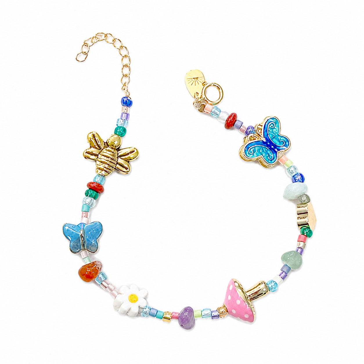 Lucky charm bracelet with natural gemstones, gold-tone charms, and symbolic talismans.