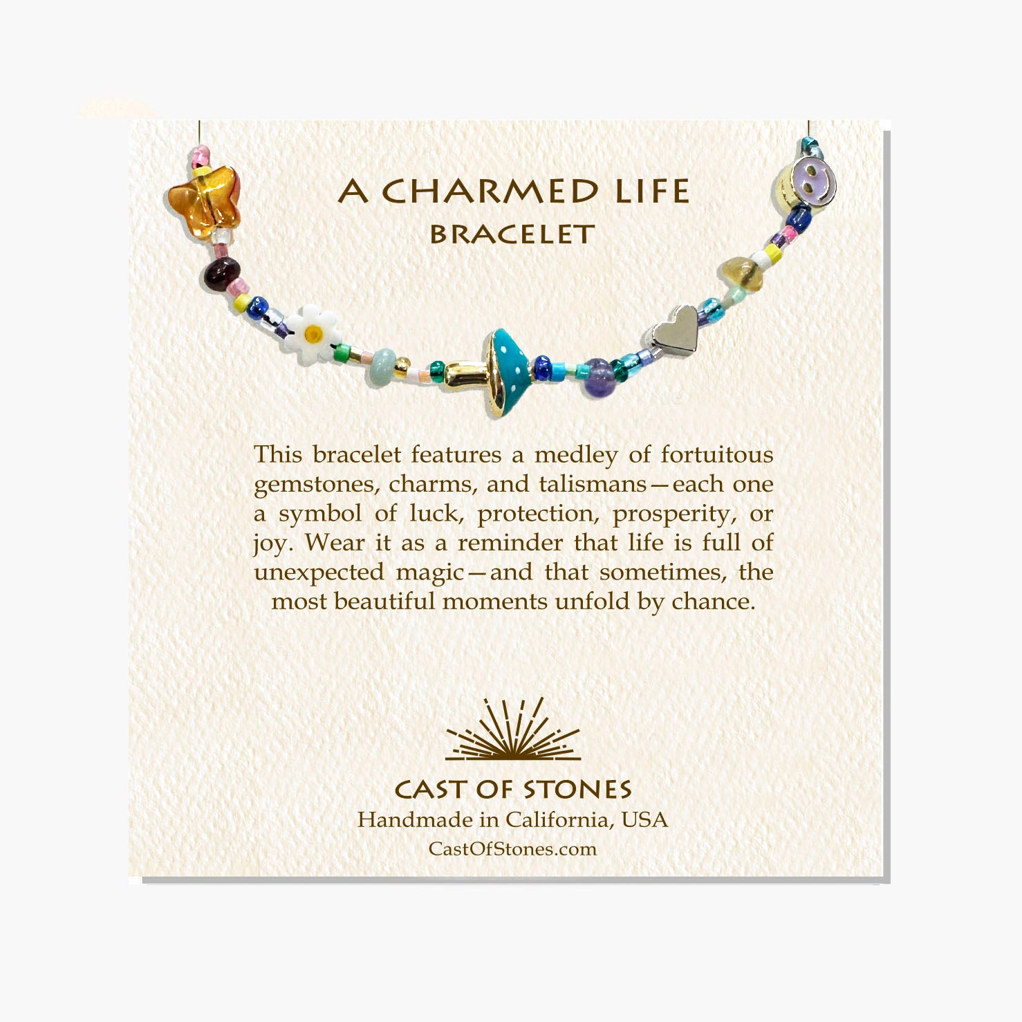 Lucky charm bracelet with natural gemstones, gold-tone charms, and symbolic talismans.