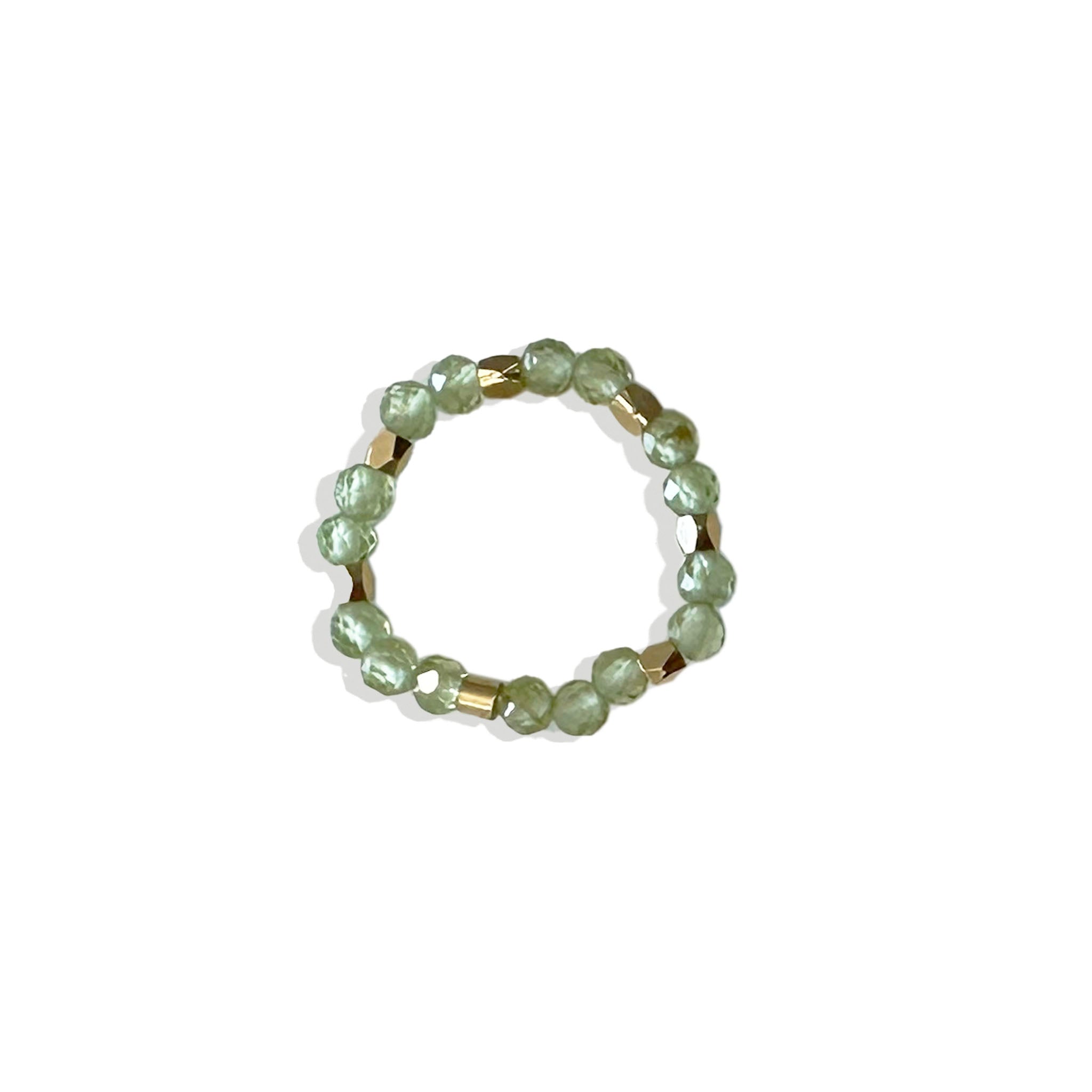 Peridot beaded ring on a white background